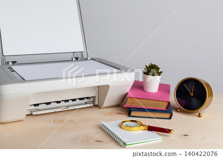 White scanner or printer machine on a table close up White scanner or printer machine on a table close up 140422076