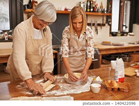 Grandmother, grandchild and together at home to bake gluten free homemade pie, bonding and learning grandma recipe. Senior person, woman and ingredients to prepare or cooking with family love 140422096