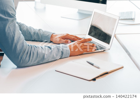 Unrecognizable man working in a modern office 140422174