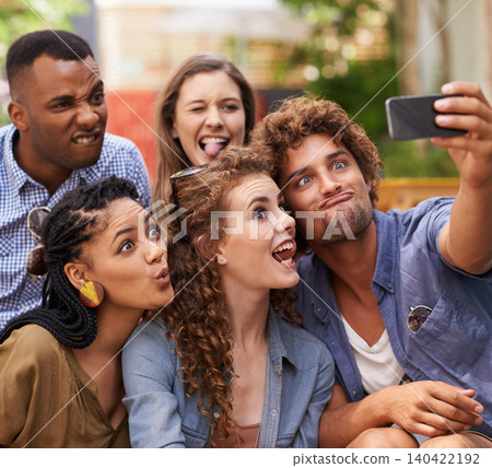 Friends, happy and crazy selfie on campus for comedy, care and profile picture to update on social media. Students, diversity or mobile app for photography at university or memory together in outdoor 140422192