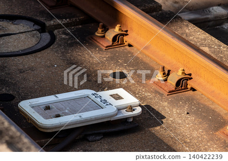 Details of the rail infrastructure, including the ground coils on the slab track, bathed in the early morning light. 140422239
