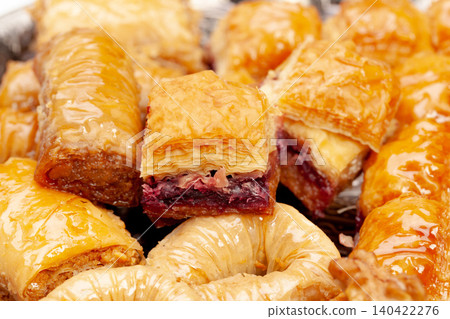 Stacked turkish baklava dessert in a plate close up Stacked turkish baklava dessert in a plate close up 140422276