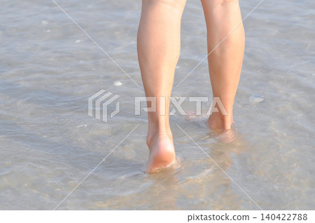 walking on the beach, beach and sand or sea or leg and feet walking on the beach, beach and sand or sea or leg and feet 140422788