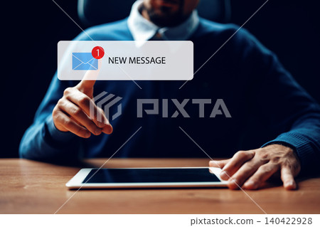 Receiving scam call sms message on a tablet during a late evening work session at home Receiving scam call sms message on a tablet during a late evening work session at home 140422928