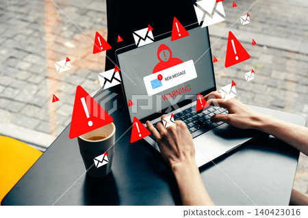 Scam call sms warning and alert on laptop screen at coffee shop in the afternoon 140423016
