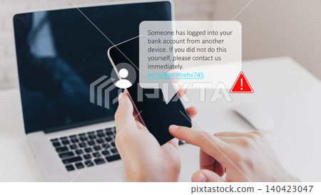 Warning message about bank account access from another device seen on a smartphone screen Warning message about bank account access from another device seen on a smartphone screen 140423047