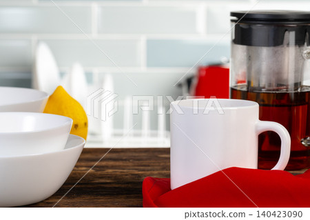 Tea served on a wooden kitchen table Tea served on a wooden kitchen table 140423090