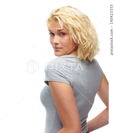 Portrait, fashion and serious with casual woman looking back in studio isolated on white background. Model, hair or confident with shoulder of young person in relaxed clothing outfit for trendy style Portrait, fashion and serious with casual woman looking back in studio isolated on white background. Model, hair or confident with shoulder of young person in relaxed clothing outfit for trendy style 140423355