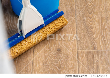 Cleaning tools for house cleaning on wooden floor Cleaning tools for house cleaning on wooden floor 140423364