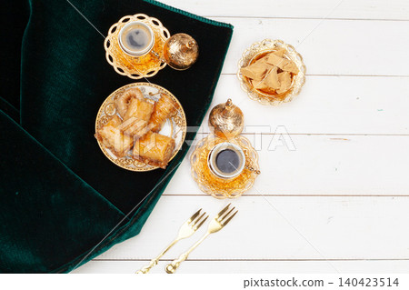 Cup of hot tea and a plate of turkish desserts Cup of hot tea and a plate of turkish desserts 140423514