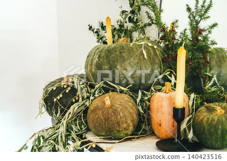 Beautiful autumn table decor with green pumpkin Beautiful autumn table decor with green pumpkin 140423516