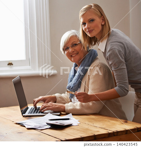 Granddaughter, grandmother and help with laptop for budget, finance and technology with advice and assistance. Women pay bills online, life insurance or tax paperwork with retirement and portrait 140423545