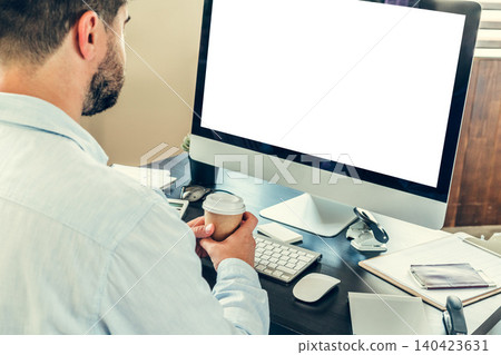 Young man businessman sitting at his working table in office Young man businessman sitting at his working table in office 140423631