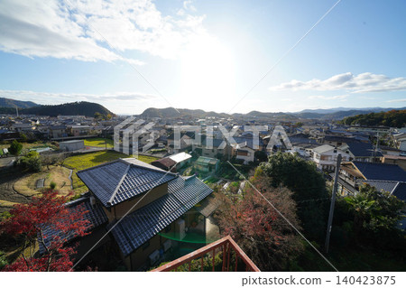 View of the city of Iwakura from Kamitakano, Kyoto, as seen from a temple in Kamitakano, northern Kyoto. View of the city of Iwakura from Kamitakano, Kyoto, as seen from a temple in Kamitakano, northern Kyoto. 140423875