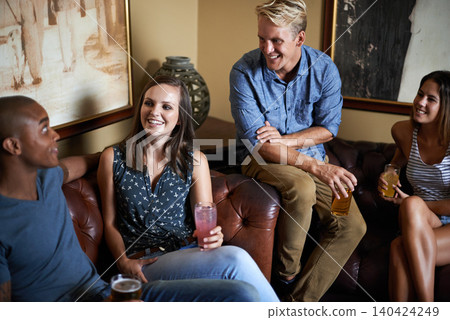 Conversation, happy friends or drink alcohol in pub at party for celebration together in restaurant. Smile, diverse group or people with beer, cocktail or glass at bar for talking at social gathering Conversation, happy friends or drink alcohol in pub at party for celebration together in restaurant. Smile, diverse group or people with beer, cocktail or glass at bar for talking at social gathering 140424249