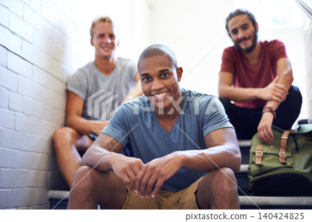 Portrait, students and happy in university stairs, relaxing and sitting together for break or before class. College people, friends and diversity on campus for education, backpack and casual outfit Portrait, students and happy in university stairs, relaxing and sitting together for break or before class. College people, friends and diversity on campus for education, backpack and casual outfit 140424825