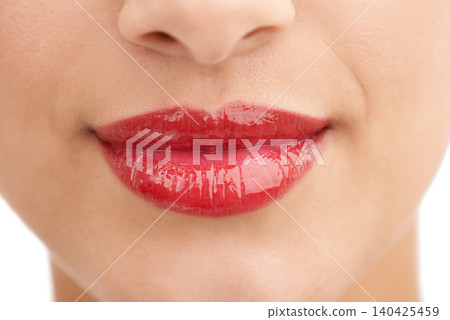 Person, red lipstick and closeup of smile with makeup in cosmetics, gloss or glow in treatment. Colorful lips of woman or model in satisfaction for mouth, oral or beauty in cosmetology or dermatology Person, red lipstick and closeup of smile with makeup in cosmetics, gloss or glow in treatment. Colorful lips of woman or model in satisfaction for mouth, oral or beauty in cosmetology or dermatology 140425459