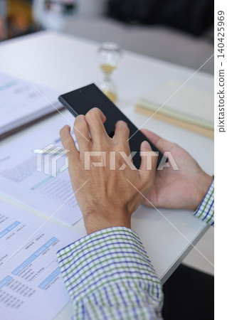 Corporate Accountant Reviewing Company Expenses and Financial Document Corporate Accountant Reviewing Company Expenses and Financial Document 140425969