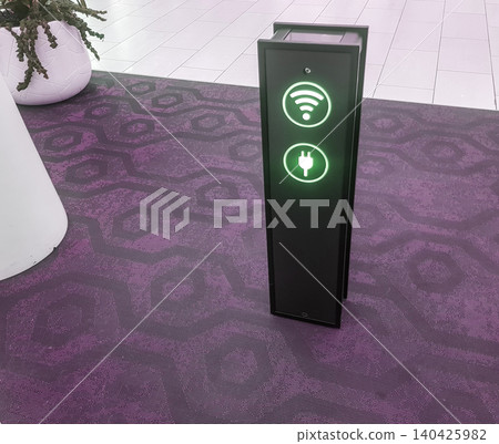 Close-up of a phone charging stand via usb and a Wi-Fi zone at the airport or supermarket Close-up of a phone charging stand via usb and a Wi-Fi zone at the airport or supermarket 140425982