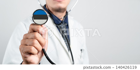 Estonia healthcare system, Estonian national healthcare concept. Hand of doctor holding stethoscope Estonia healthcare system, Estonian national healthcare concept. Hand of doctor holding stethoscope 140426119