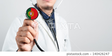 Portugal healthcare system, Portuguese national healthcare concept. Hand of doctor holding stethoscope Portugal healthcare system, Portuguese national healthcare concept. Hand of doctor holding stethoscope 140426247