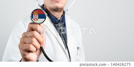 Serbia healthcare system, Serbian national healthcare concept. Hand of doctor holding stethoscope Serbia healthcare system, Serbian national healthcare concept. Hand of doctor holding stethoscope 140426275