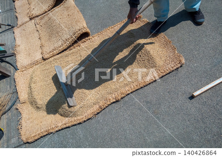 Rice drying on mats Rice drying on mats 140426864