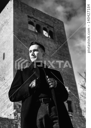 Man In Black Coat At Castle Viewpoint Man In Black Coat At Castle Viewpoint 140427184
