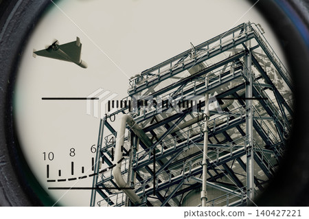 Strike drone detected above industrial infrastructure through optical scope during surveillance operation. Strike drone detected above industrial infrastructure through optical scope during surveillance operation. 140427221