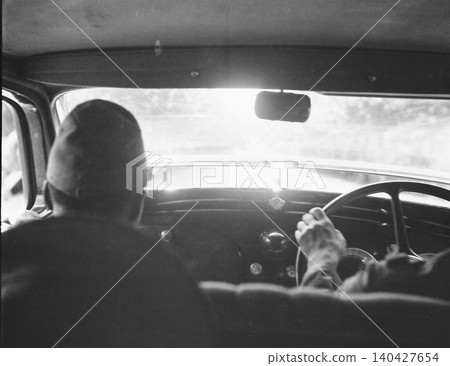 Vintage photograph, 1937-1945, Republic of China during the Second Sino-Japanese War: Japanese soldiers driving a car in Nanjing or Shanghai. 140427654