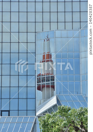 Kyoto Tower reflected in the Kyoto Station Building Kyoto Tower reflected in the Kyoto Station Building 140428387