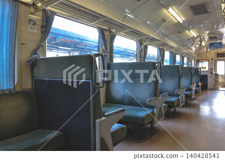 April 26 2026 Local train interior seating with windows and overhead racks April 26 2026 Local train interior seating with windows and overhead racks 140428541