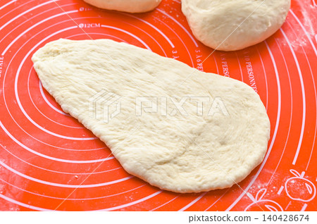 Shaped naan dough 140428674