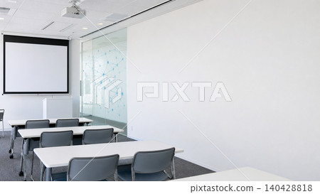 The training venue had white walls and a conference room with a copy space. 140428818