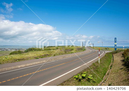 A road with a view of the blue sky and the sea A road with a view of the blue sky and the sea 140429706