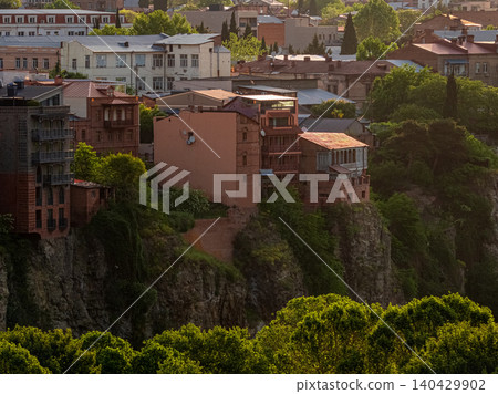 Roofs of houses in old Tbilisi. Georgia. A pattern with the architecture of the city. Roofs of houses in old Tbilisi. Georgia. A pattern with the architecture of the city. 140429902
