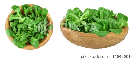 Valerian leaves salad. Corn salad in wooden bowl isolated on white backgrounds. Lettuce salad. Top view Valerian leaves salad. Corn salad in wooden bowl isolated on white backgrounds. Lettuce salad. Top view 140430015