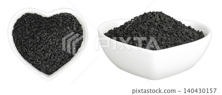 Nigella sativa or Black cumin in ceramic bowl isolated on white background. Top view. Flat lay. 140430157