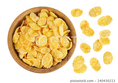 Cornflakes in wooden bowl isolated on white background. Top view. Flat lay Cornflakes in wooden bowl isolated on white background. Top view. Flat lay 140430213