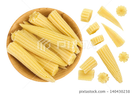 Pickled young baby corn cobs in wooden bowl isolated on white background Top view. Flat lay Pickled young baby corn cobs in wooden bowl isolated on white background Top view. Flat lay 140430238