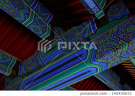 Close-up of colorful traditional ceiling decoration inside the Temple of Heaven in Beijing, China. Close-up of colorful traditional ceiling decoration inside the Temple of Heaven in Beijing, China. 140430651