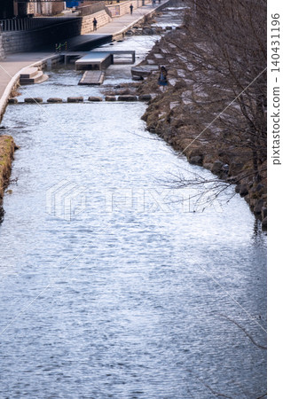 Cheonggyecheon stream, a modern public space in Seoul, South Korea, in beginning of spring. It transformed street to be environmentally sustainable and pedestrian oriented public space. Cheonggyecheon stream, a modern public space in Seoul, South Korea, in beginning of spring. It transformed street to be environmentally sustainable and pedestrian oriented public space. 140431196