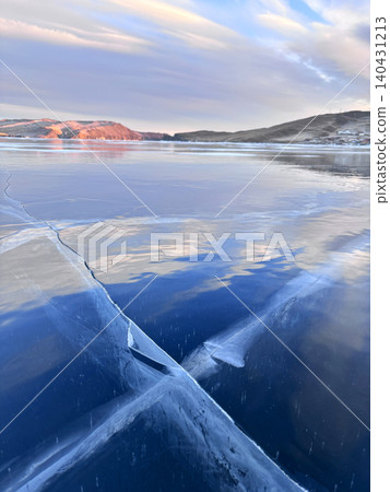Frozen Lake Baikal on a sunny winter day. Frozen Lake Baikal on a sunny winter day. 140431213