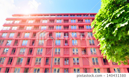 European residential architecture harmonizing with nature. Eco-friendly living in city with greens. Eco apartment building saving energy and fresh air concept. European residential architecture harmonizing with nature. Eco-friendly living in city with greens. Eco apartment building saving energy and fresh air concept. 140431380