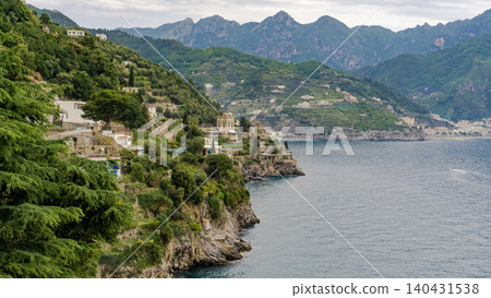 View of beautiful Amalfi town, Campania, Italy. Amalfi coast is most popular travel and holiday destination in Europe. Amalfi cityscape on coast line of mediterranean sea, Amalfi coast, Italy. View of beautiful Amalfi town, Campania, Italy. Amalfi coast is most popular travel and holiday destination in Europe. Amalfi cityscape on coast line of mediterranean sea, Amalfi coast, Italy. 140431538