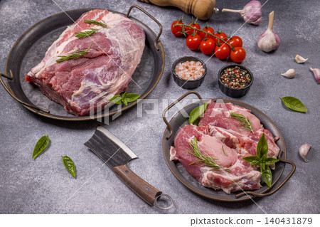 Raw pork meat cuts with fresh cooking ingredients Raw pork meat cuts with fresh cooking ingredients 140431879