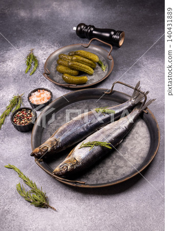 Salted herring with pickled cucumbers and spices 140431889