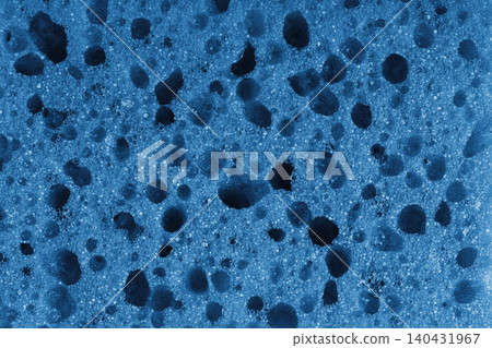 Macro, closeup of blue foam sponge texture with porous, spongy and bubbly pattern background Macro, closeup of blue foam sponge texture with porous, spongy and bubbly pattern background 140431967