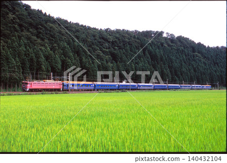 The Nihonkai sleeper train runs through the countryside. The Nihonkai sleeper train runs through the countryside. 140432104