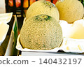 A close-up of a fresh muskmelon with beautiful netting, found in a supermarket or market. 140432197
